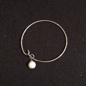 Swarovski Jewelry - A Swarovski pearl charm bangle bracelet Swarovski Jewelry - A Swarovski pearl charm bangle bracelet